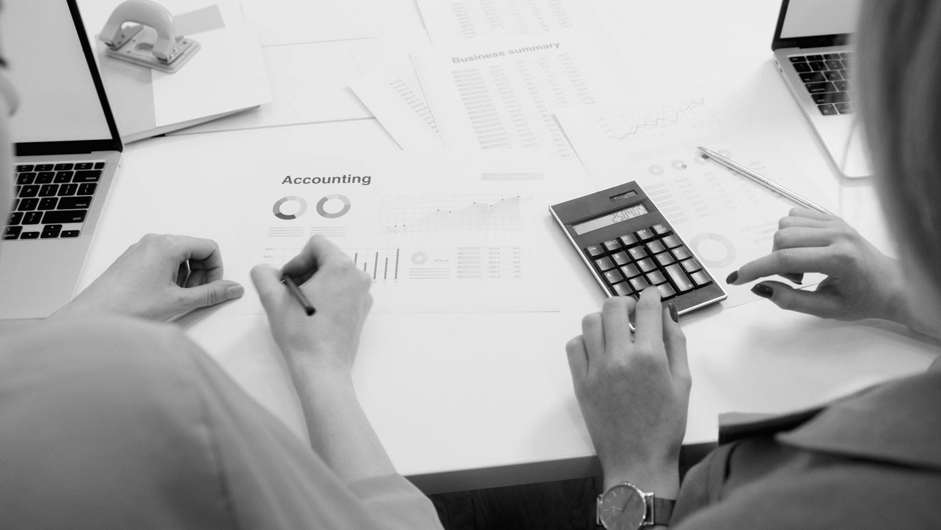 Agency founder reviewing financial forecasts with an ICAEW qualified accountant in a modern UK office