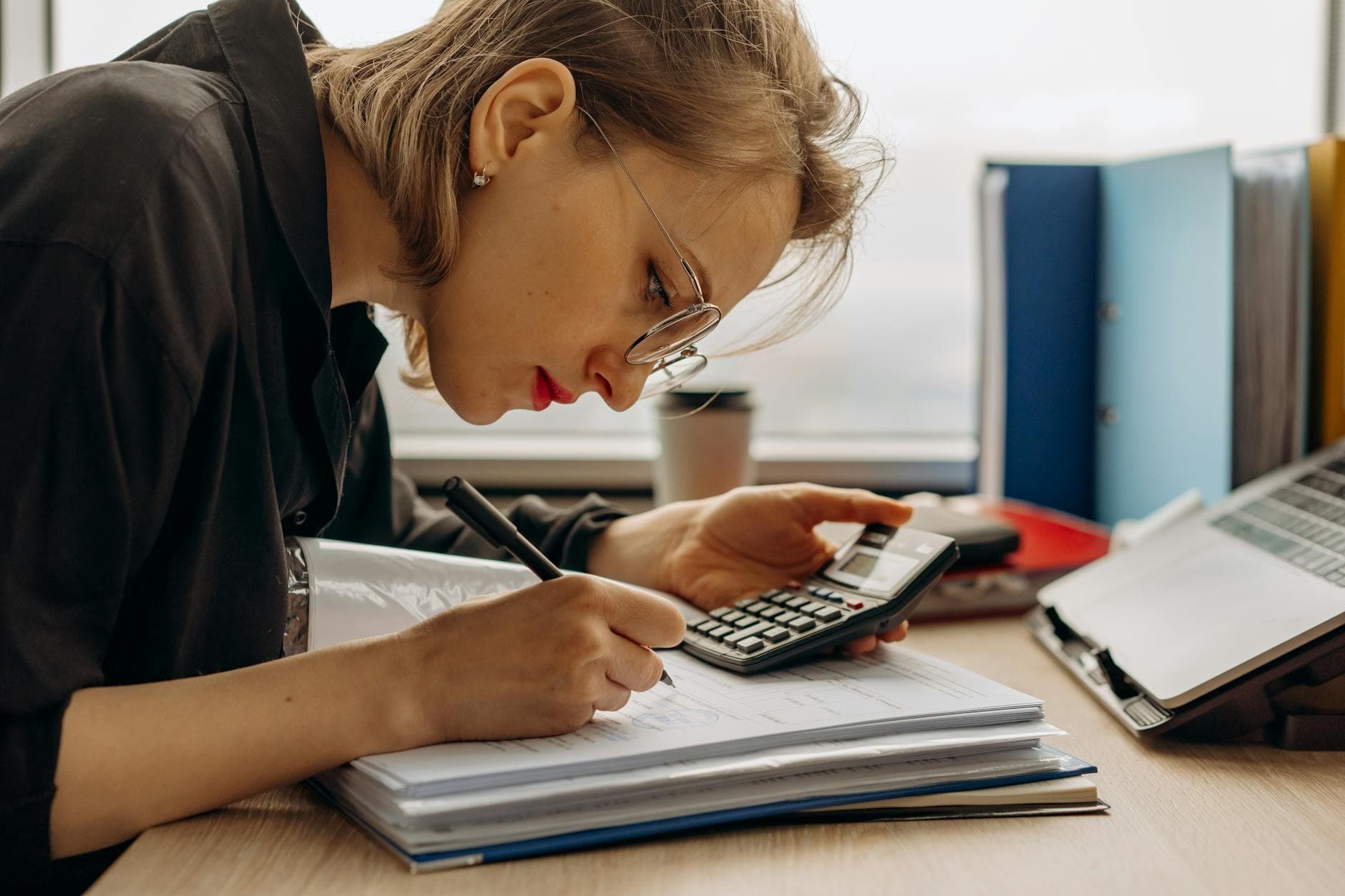 UK agency founder reviewing management accounts with an ICAEW qualified accountant in a modern office