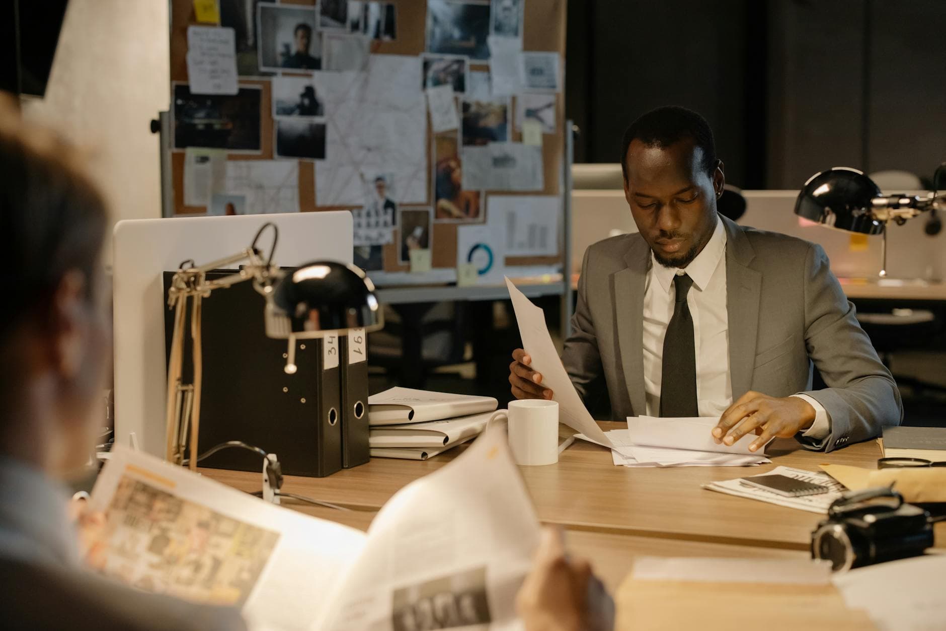 Agency founder reviewing technical documentation with accountant in a Shoreditch office