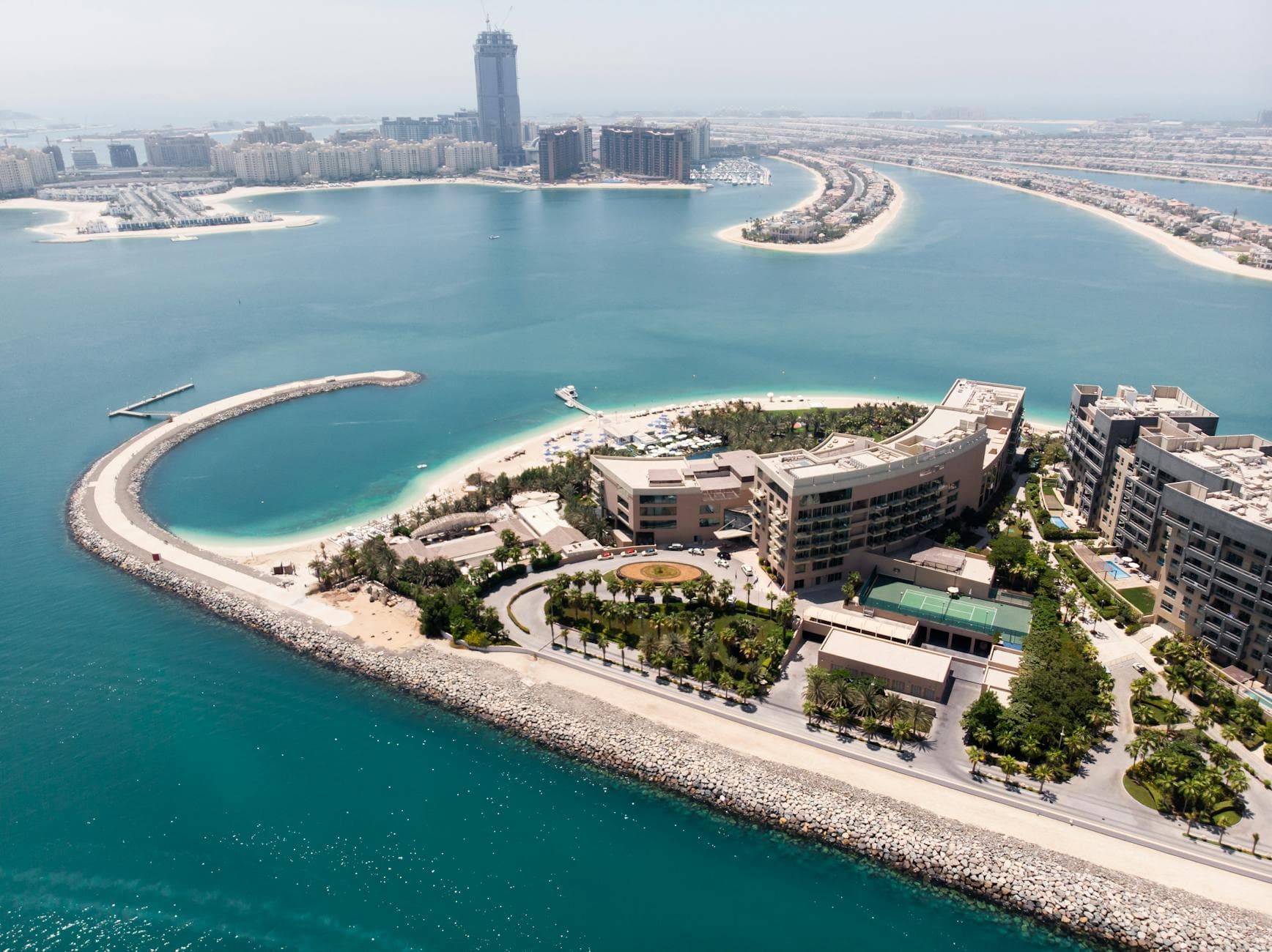 UK agency founder at a Dubai business centre desk reviewing visa sponsorship paperwork for a solo founder setup