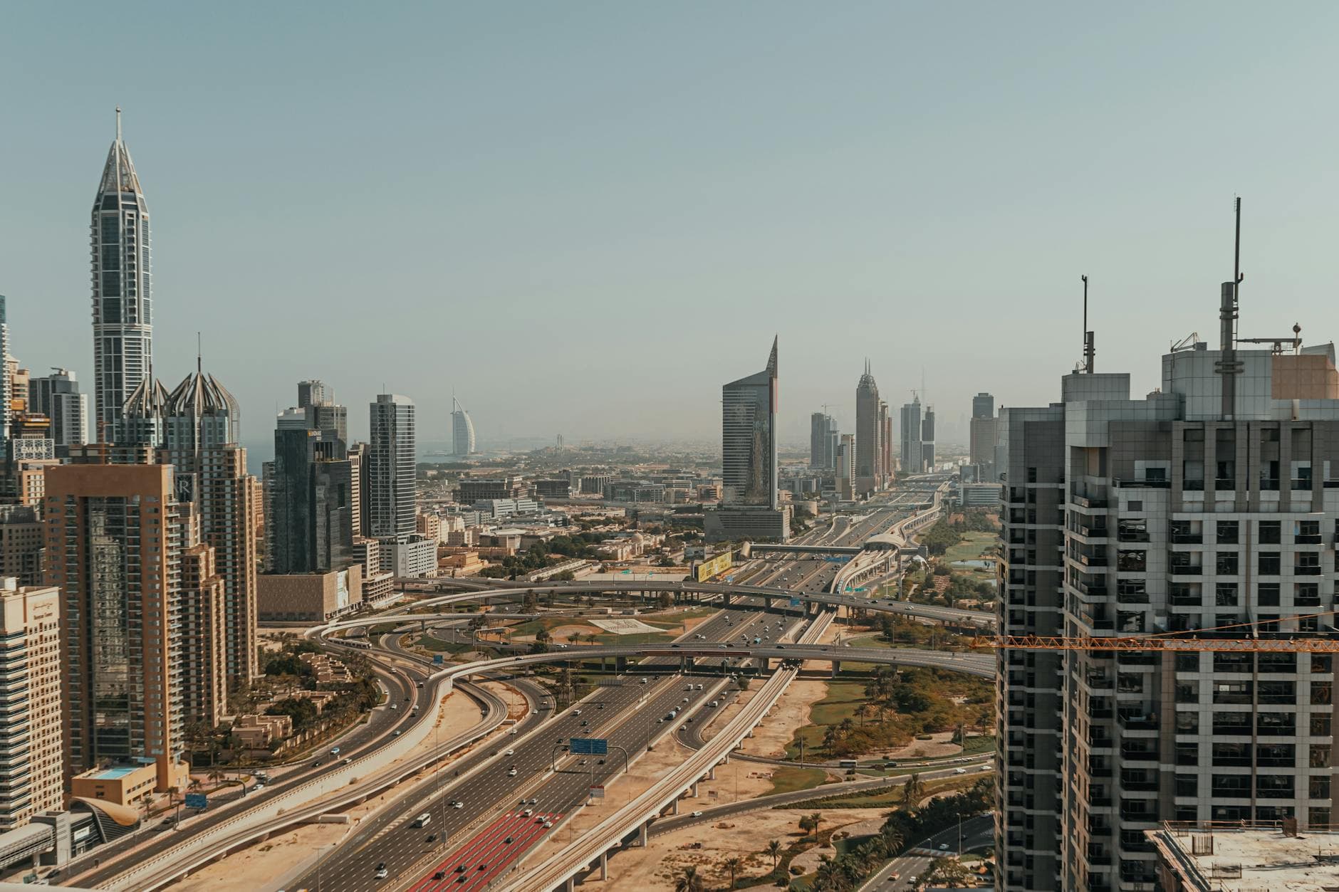 UK agency founder reviewing Dubai free zone company setup cost 2025 on a laptop in a modern Dubai office