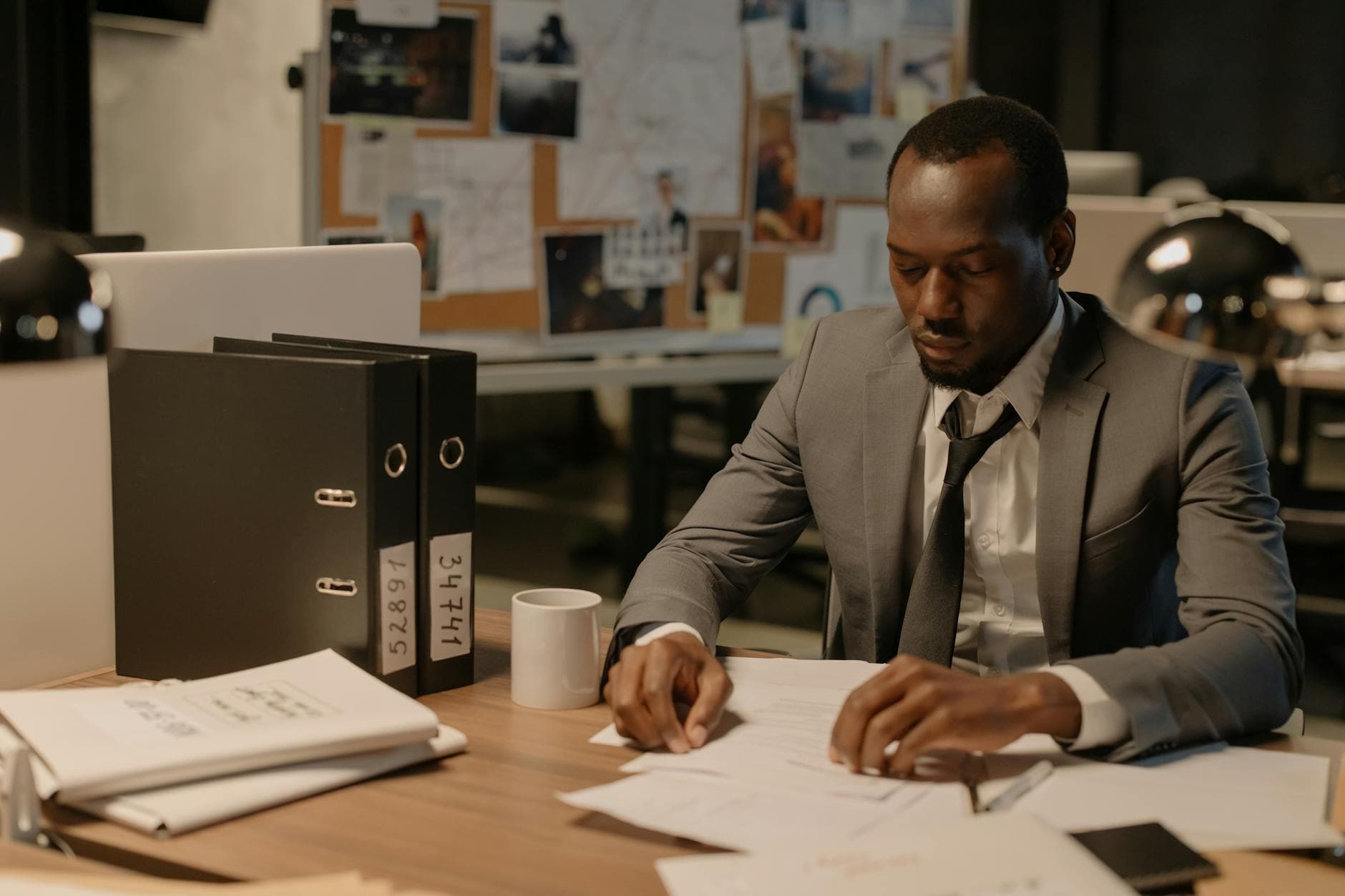 Agency founder reviewing MTD ITSA compliance documents on a tablet in a modern London office