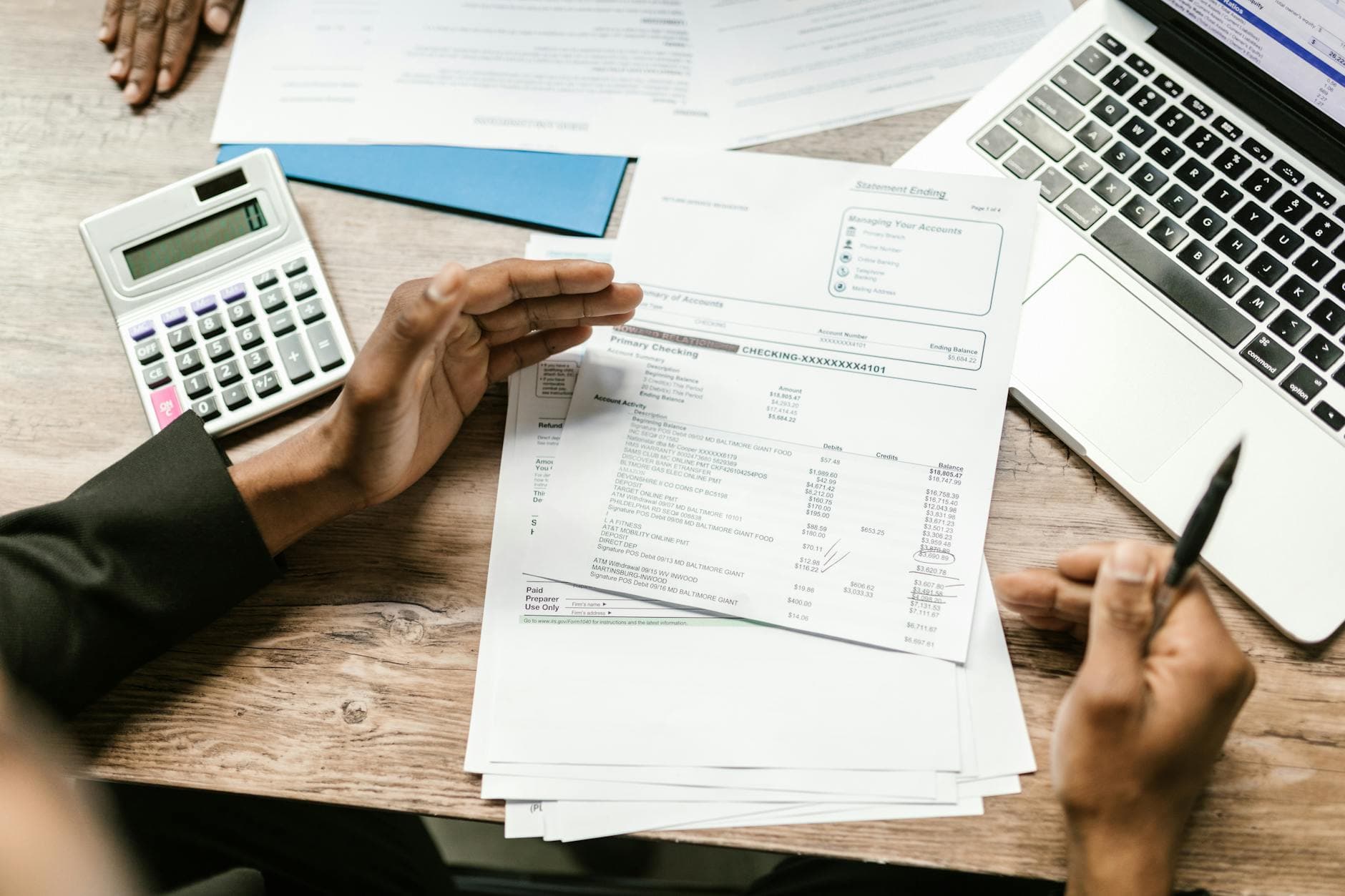 Agency founder reviewing accounting fee proposal with ICAEW qualified accountant in a modern UK office setting
