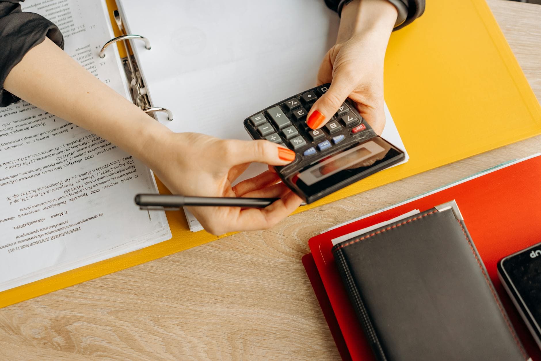 Agency founder reviewing financial reports with an accountant in a modern UK office