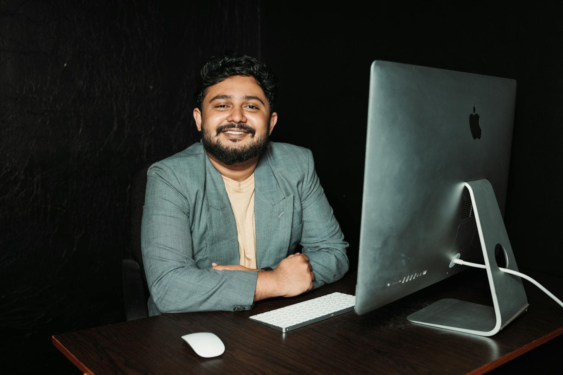 Agency founder reviewing Dubai free zone setup documents at a modern desk in a UK home office