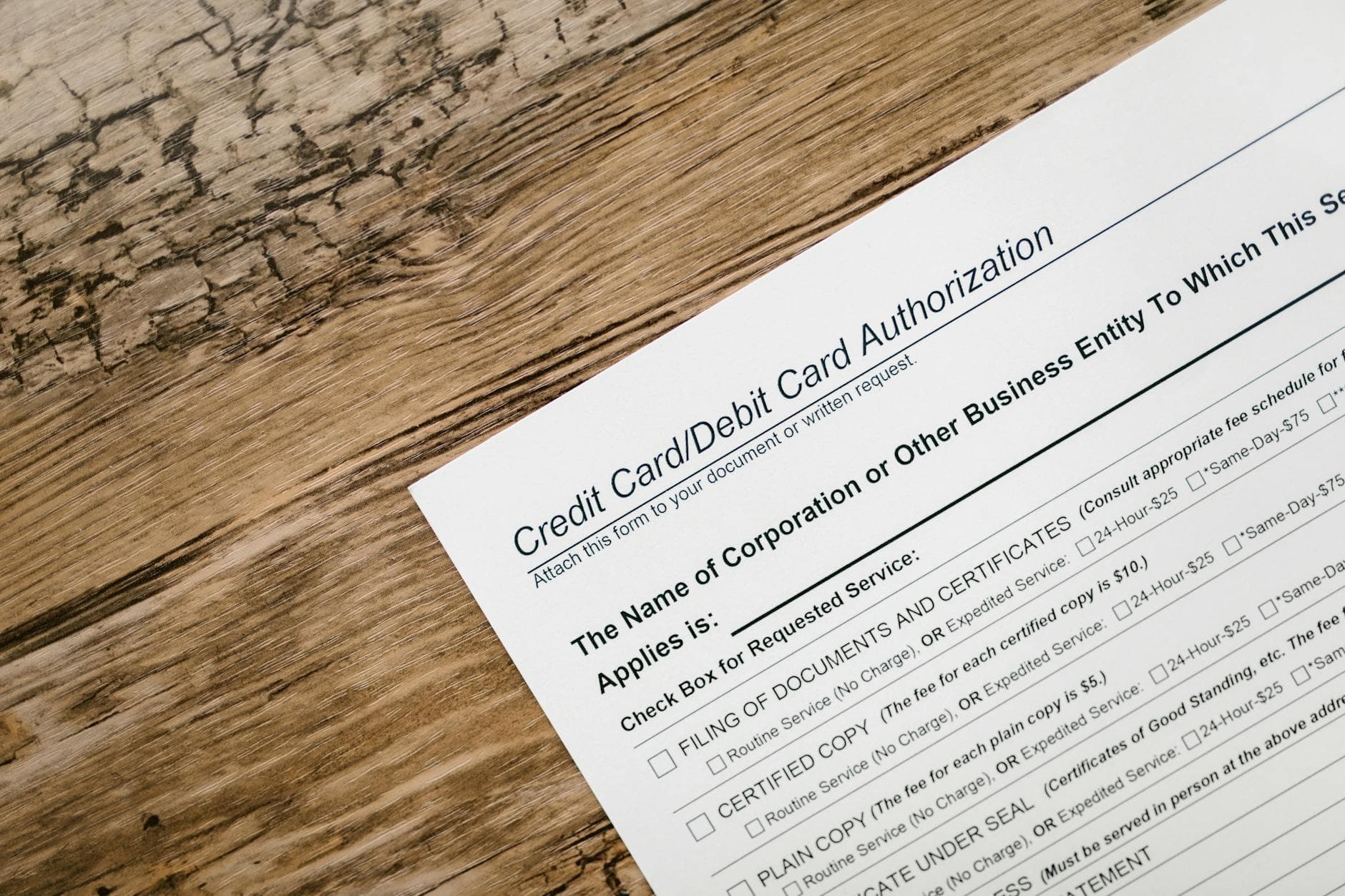UAE corporate tax registration threshold document on desk in Dubai agency office